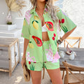 Green fruit printed short pants set with open button shirt and matching drawstring shorts