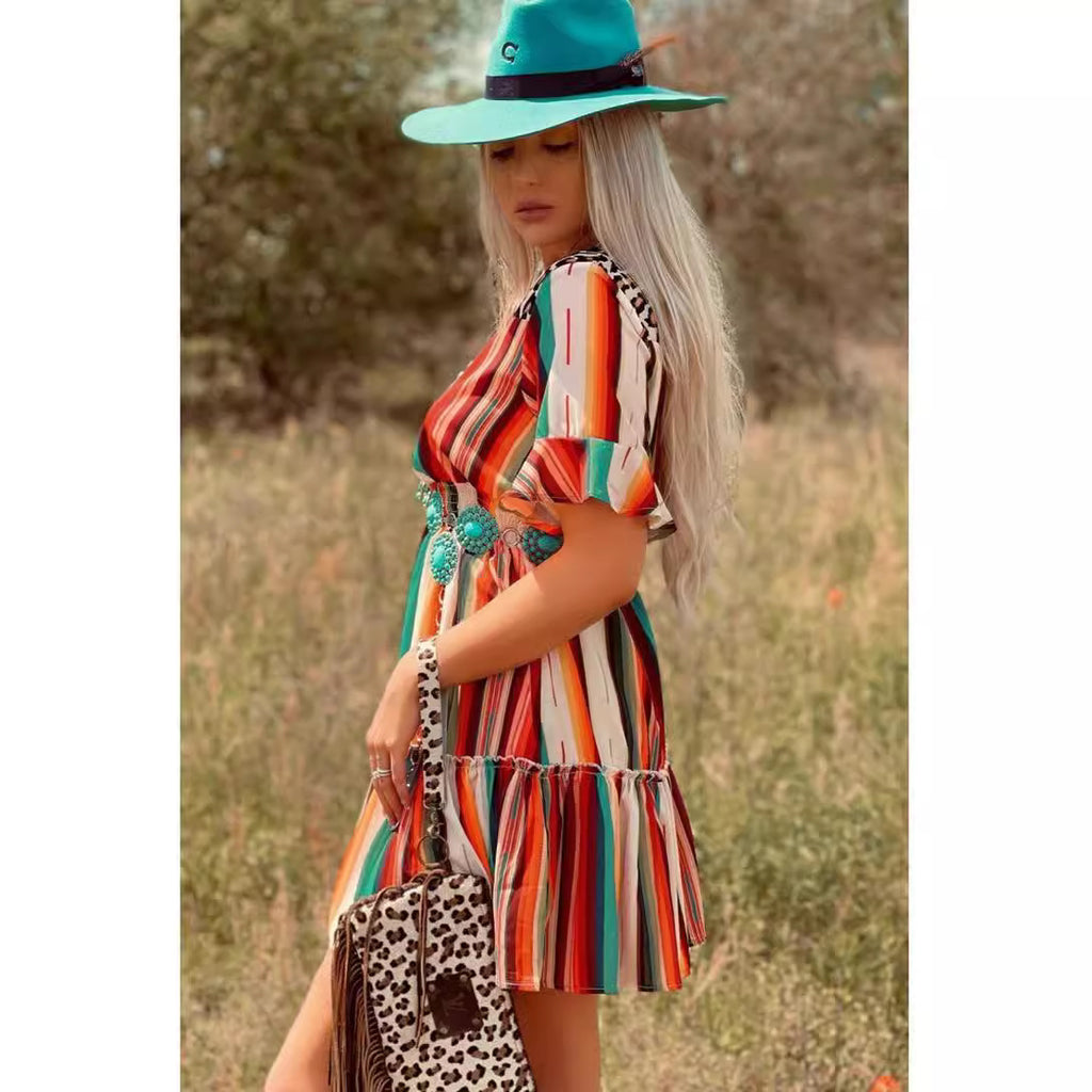 Colorful vertical striped flared short-sleeve dress with turquoise trim, side view