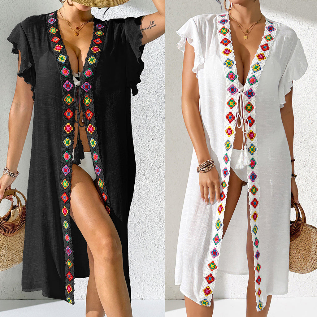 Two womens beach cover-ups shown: black and white with colorful embroidered V trim
