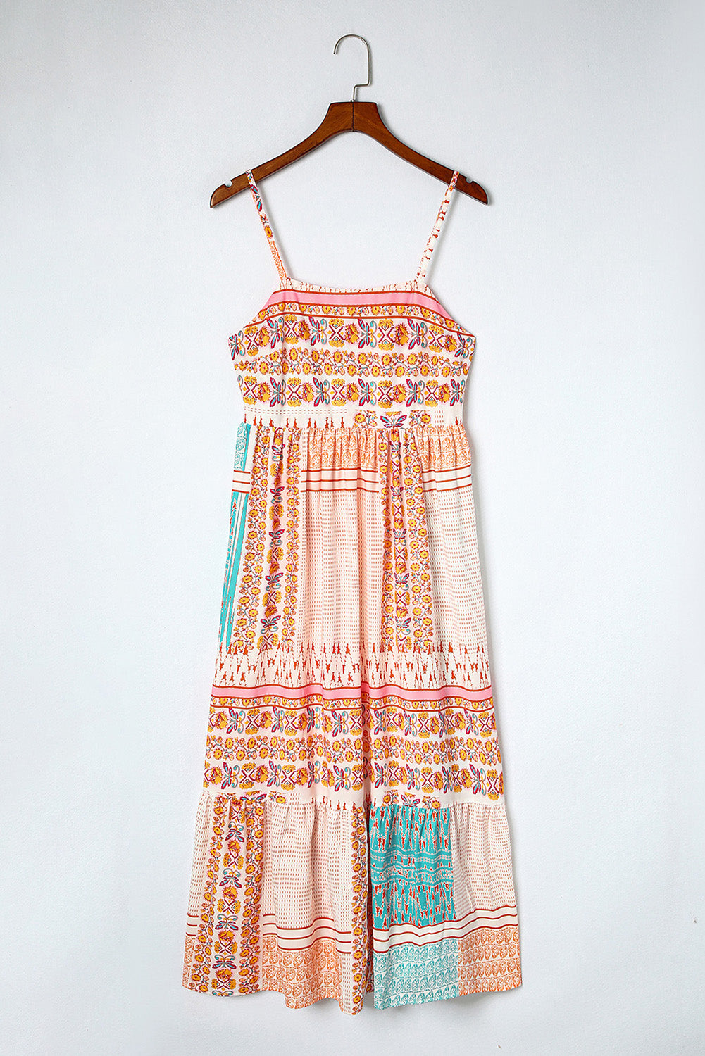 Patchwork square-neck sundress on hanger, peach with orange and turquoise tiered prints