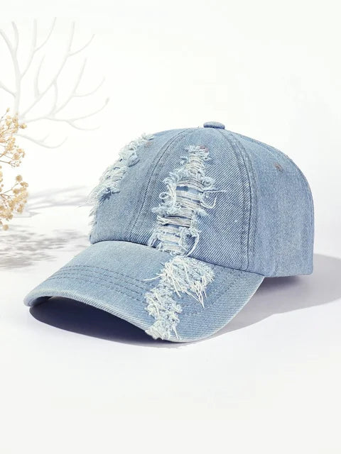 Light blue washed distressed baseball cap with white stitched graphic