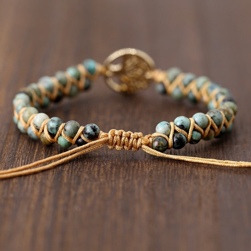 Green stone beaded wrap bracelet with tree charm and braided leather adjustable ties.