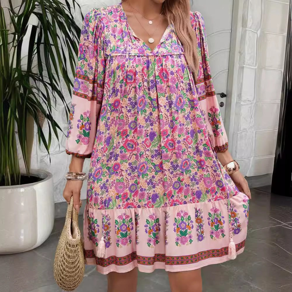 Purple floral V-neck boho dress with ruffled bib detail and tiered hem