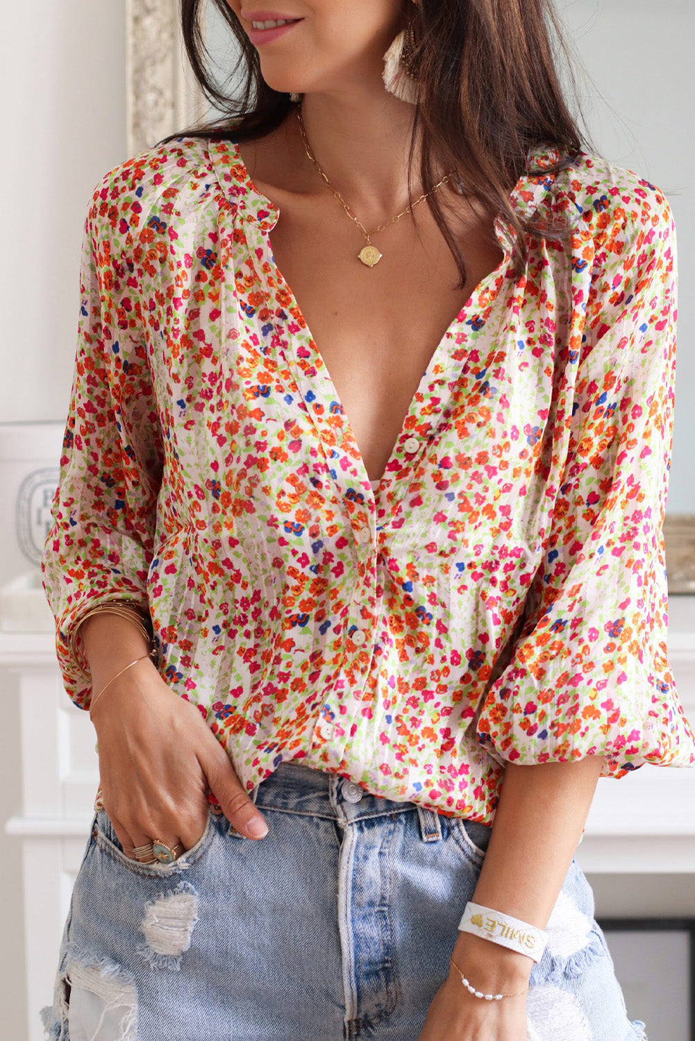Multicolor floral button-front blouse with long puff sleeves and V-neck