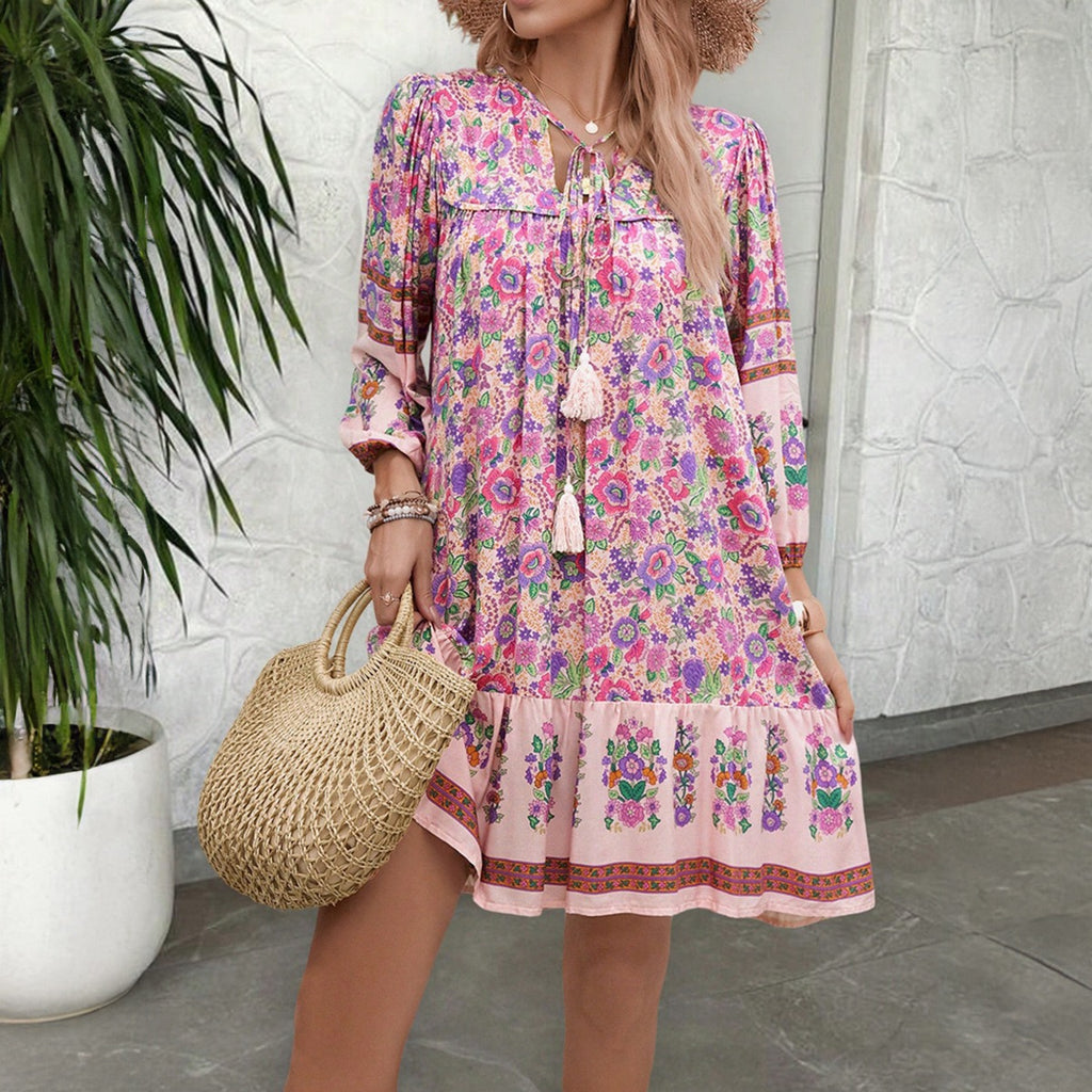 Pink and purple floral V-neck boho dress with gathered waist and tiered skirt