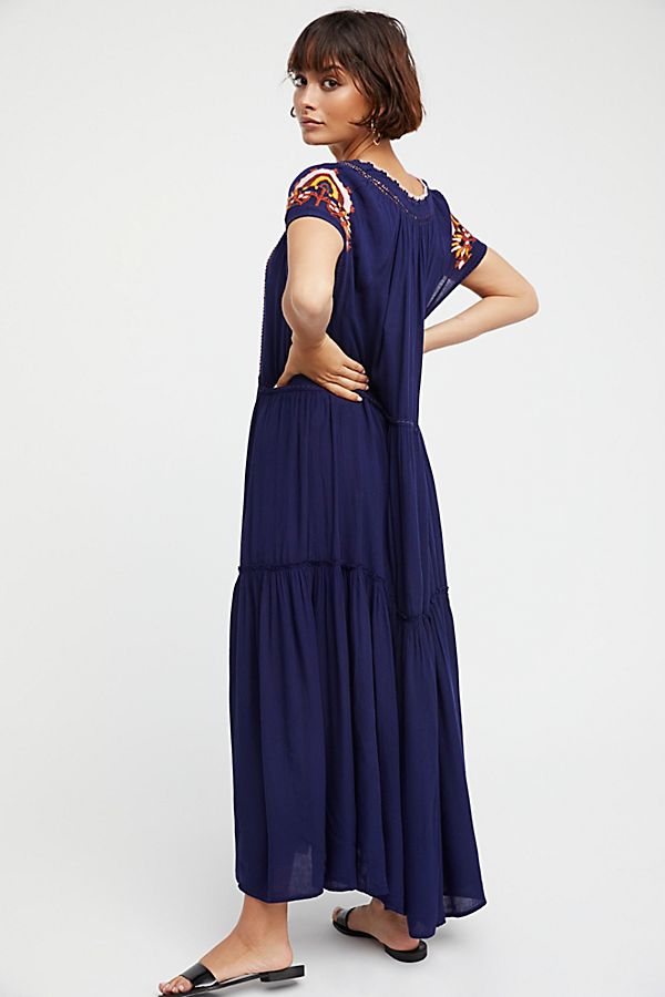 Navy blue tiered maxi dress with embroidered yoke and cap sleeves