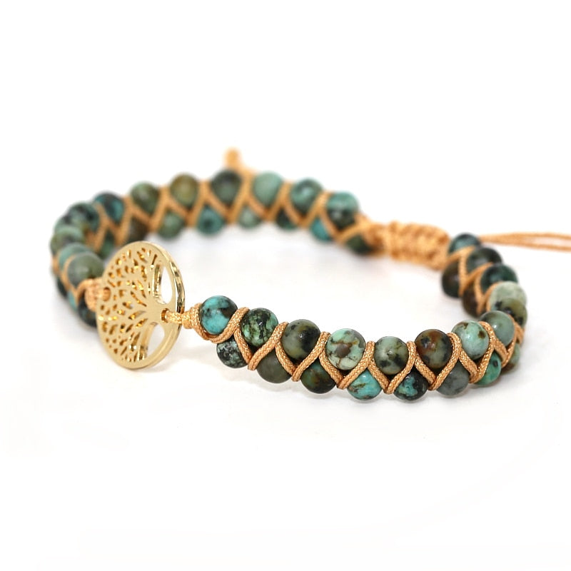 Green and blue stone beaded wrap bracelet with gold tree charm and braided cord ties.