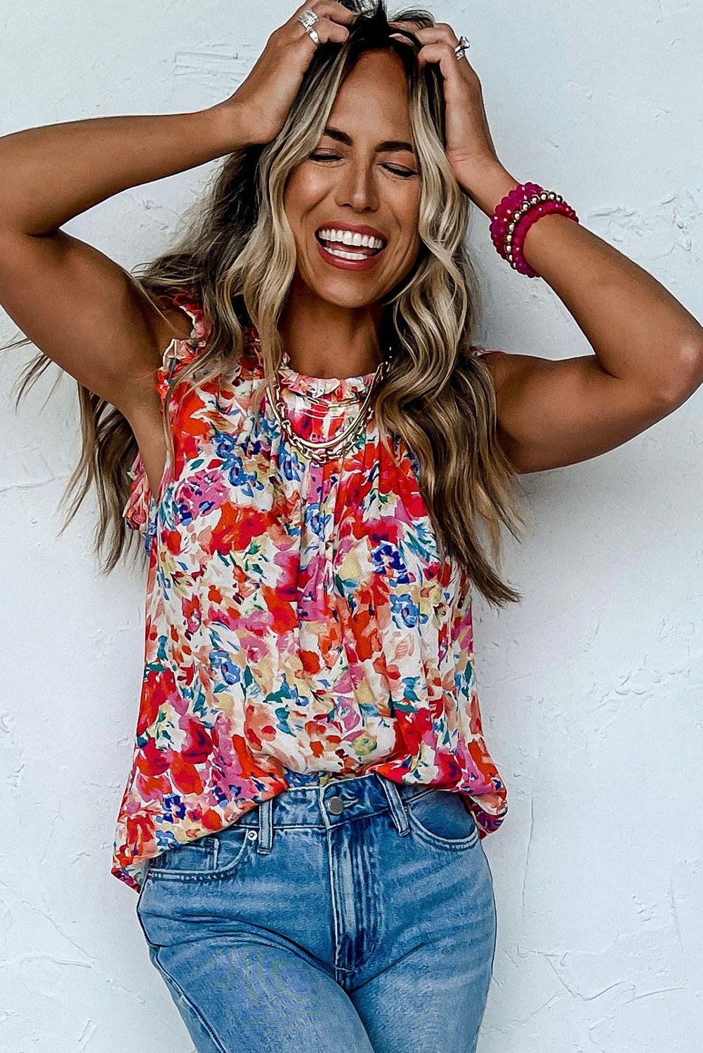 Red floral pleated tank top with frilled neck and sleeveless ruffle detail