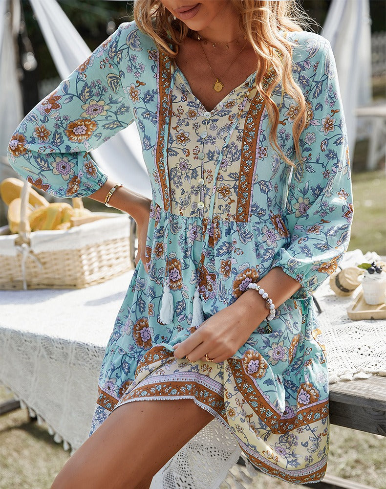 Resort one-piece dress, light blue floral print, V-neck, long sleeves, smocked bodice