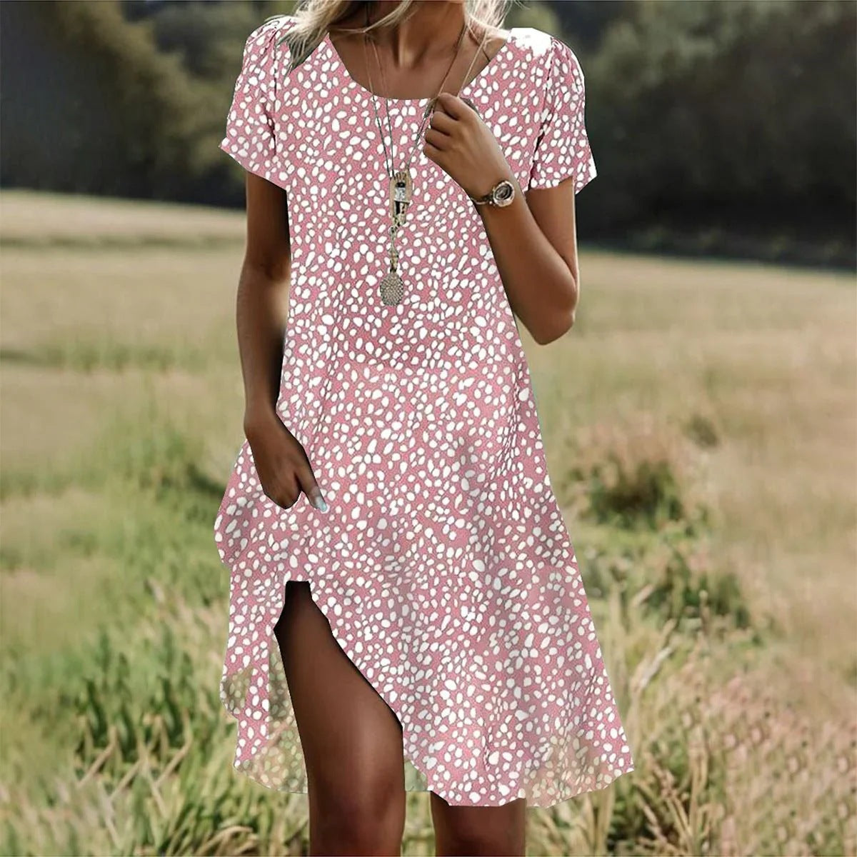 Light pink and white speckled bohemian summer dress, round neck, short sleeves, mid-length slit