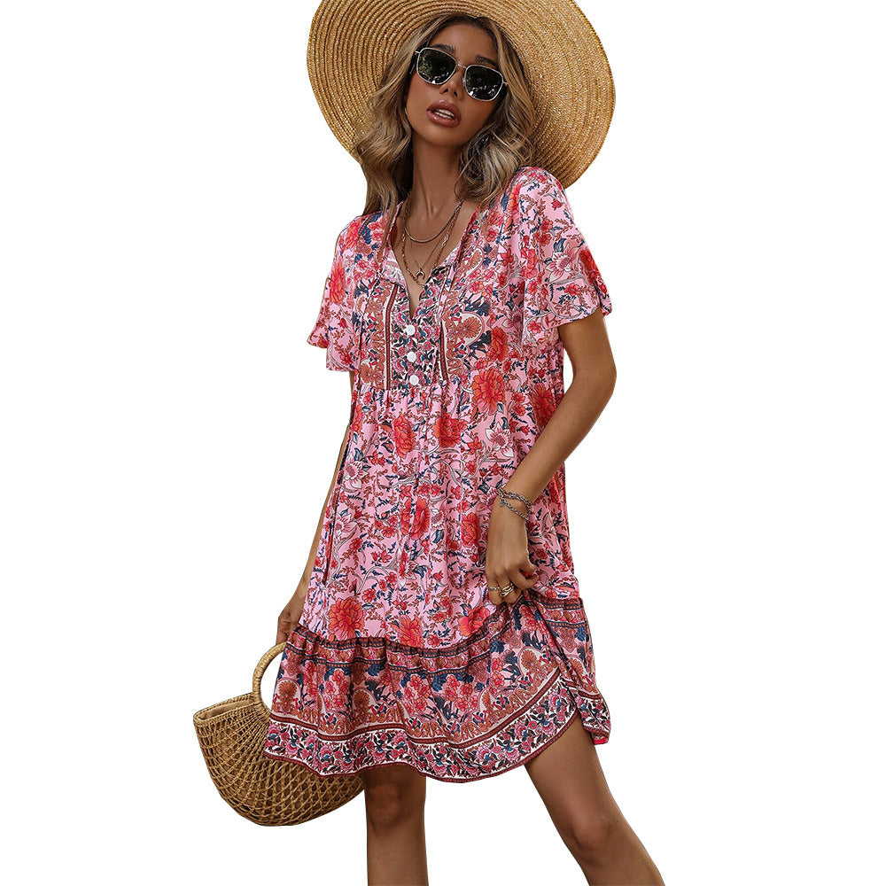 Red floral V-neck bohemian dress with short sleeves and tiered ruffle hem