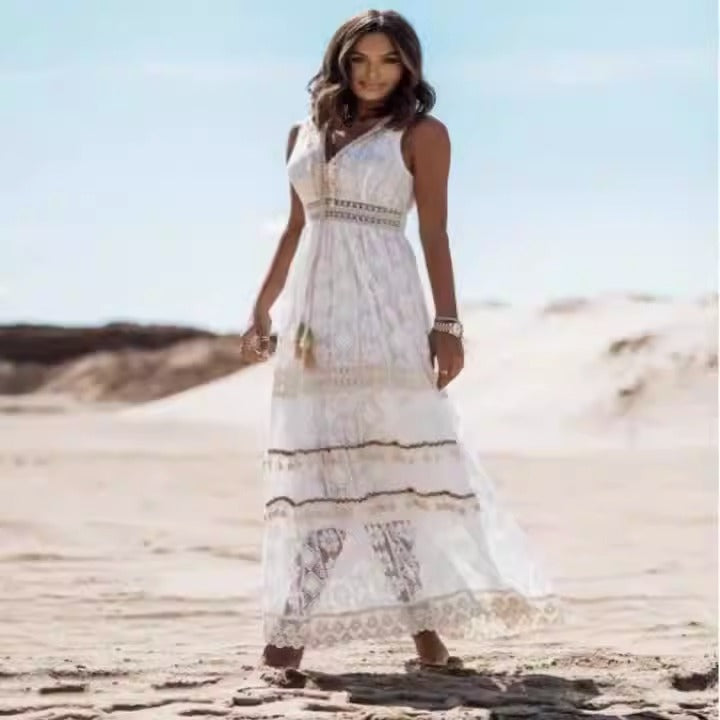 White lace maxi dress with V-neck and decorative lace trim along tiers
