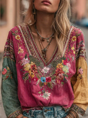 Rose red embroidered v-neck boho blouse with floral front and embroidered sleeve cuffs