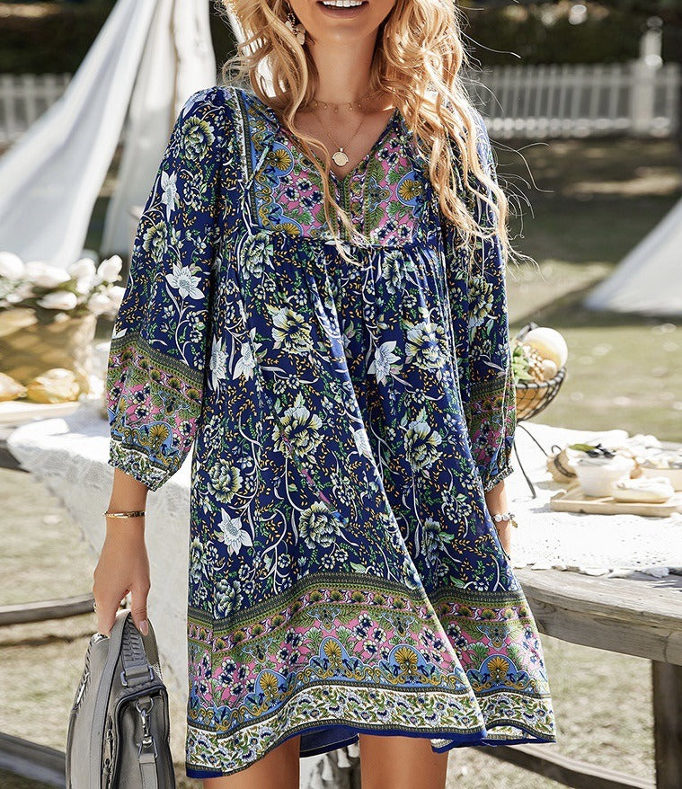 Bohemian printed long-sleeve A-line dress with V-neck lace-up detail, deep blue patterned