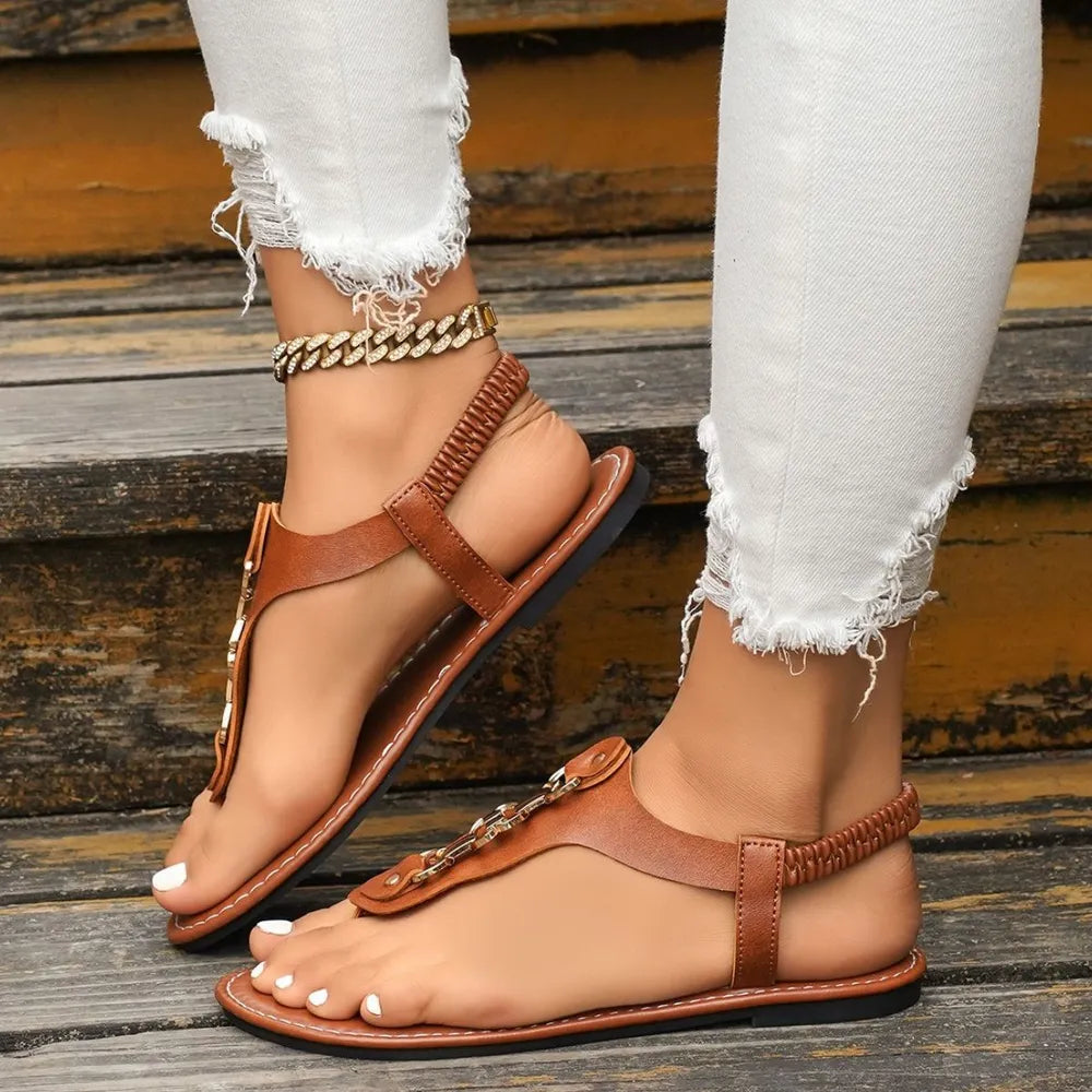 Brown flat thong sandals with ankle strap and chain detail buckle