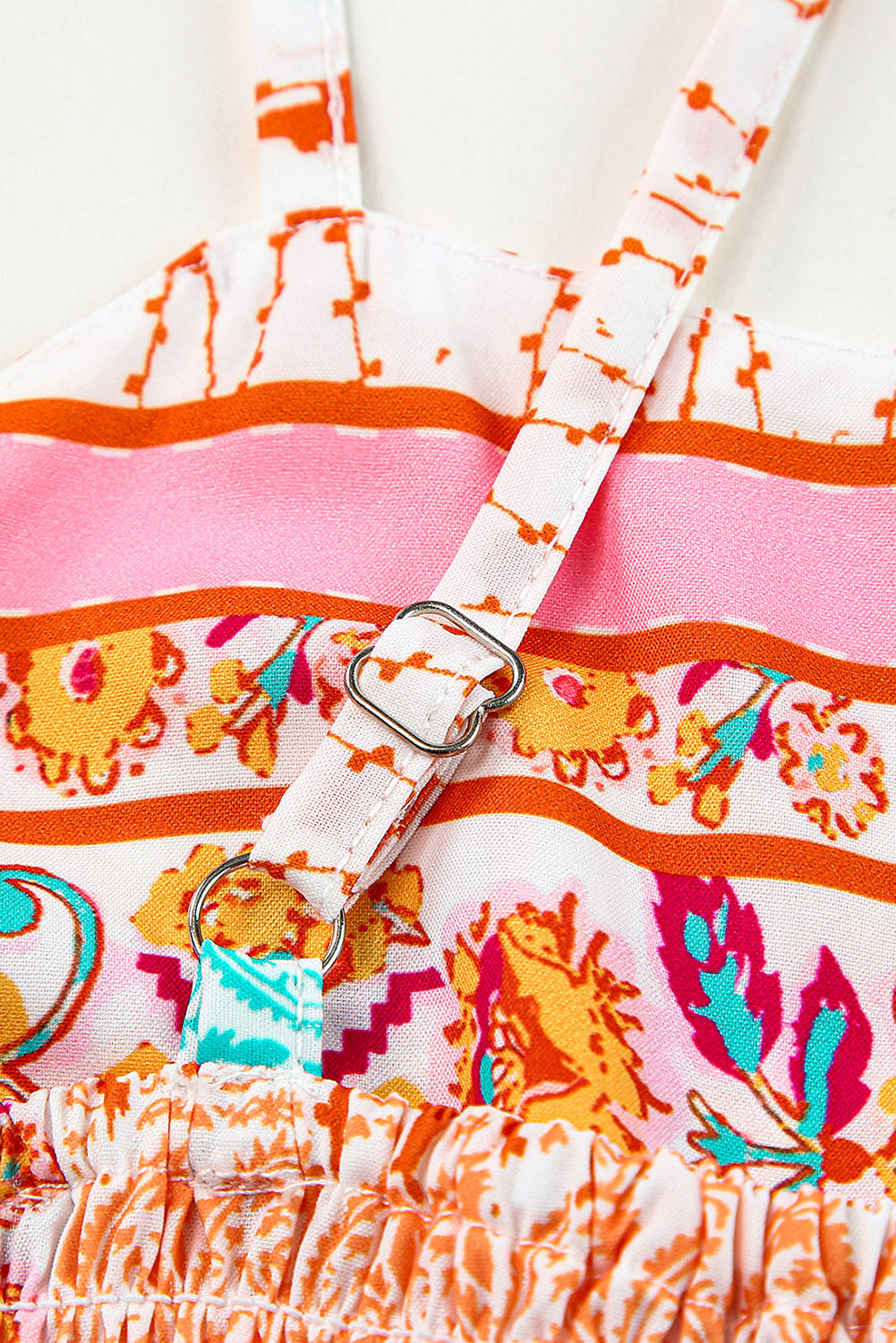 Patchwork sundress close-up of spaghetti strap and decorative buckle detail